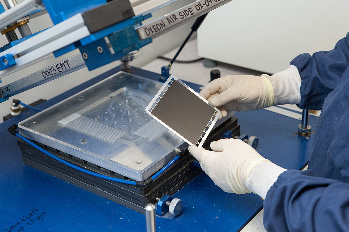 OxEon engineer printing on an electrode ink layer on a solid oxide electrolysis cell.